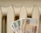 Pieniądze w tle grzejnika. Czy to zapowiedź bonu energetycznego 2026?